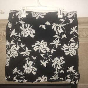 Black skirt with embroidered white flowers
